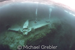 Airplane wreck under the ice at Morrison's Quarry, Quebec... by Michael Grebler 